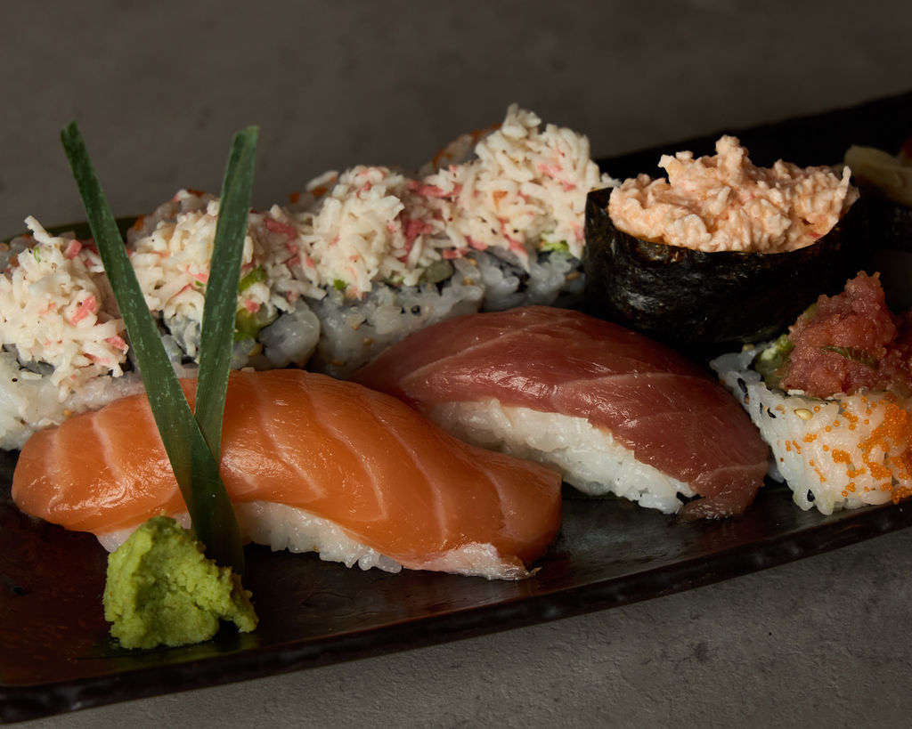 Close-up of Tokyo Lush Roll showing vivid salmon and tuna nigiri layers